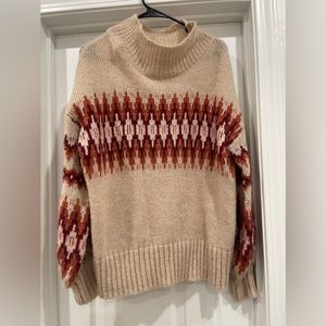 Beige turtleneck size medium with red print